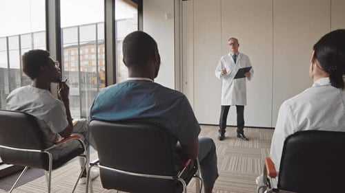 Medical Professionals Attending Lecture in Conference Room