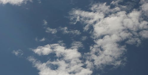 Timelapse of White Clouds Drifting Across the Blue Sky