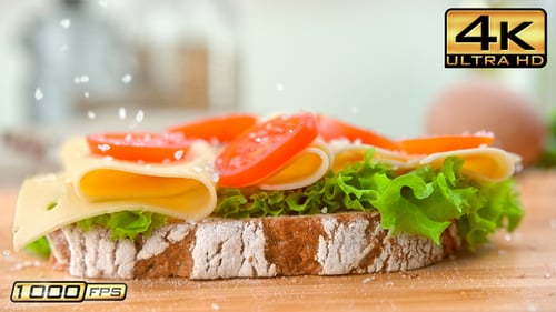 Delicious Open Sandwich with Fresh Vegetables Being Salted