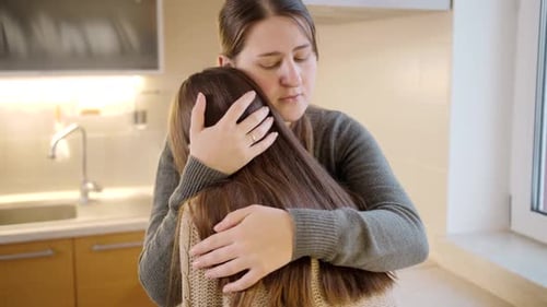 Loving Mother Hears Out Teen Daughter in Kitchen