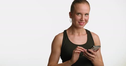 Woman Using Phone Against White Background