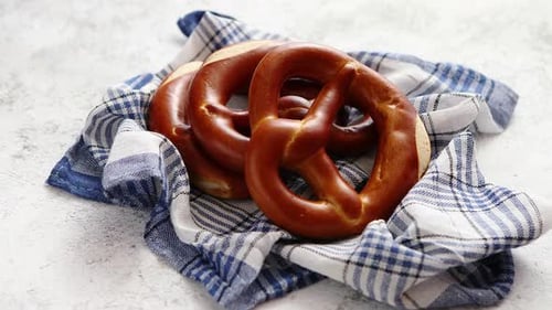 Appetizing Fresh Pretzels on a Blue Cloth