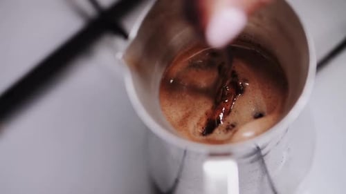 Close Up of Coffee Being Stirred in Pot