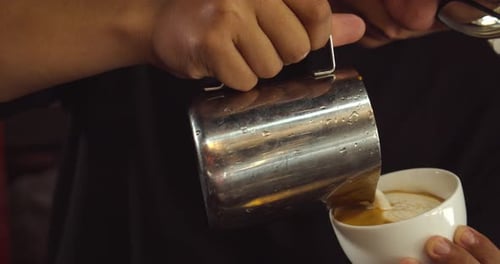 Barista Making Latte Art in Specialty Coffee Shop