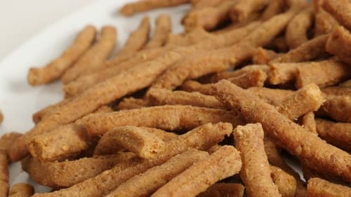 Grissini baked tasty snack made of dough with chilli slow pan 4K 2160p 30fps UltraHD footage - Crisp