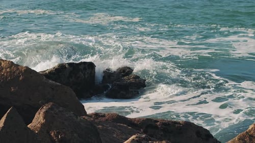 Ocean waves breaking over dangerous rocks in the Atlantic Ocean.