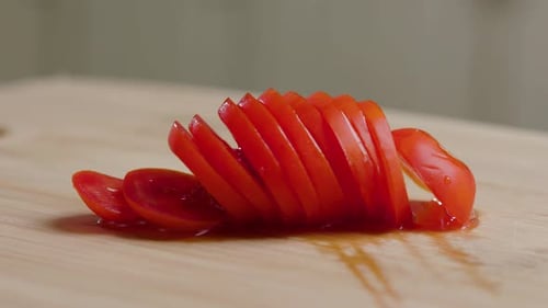 Close Up of Sliced Tomato on Board