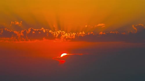 Brilliant Sunrise Over Colorful Clouds in Time Lapse