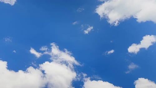 Clouds Drifting Slowly Across the Bright Blue Sky