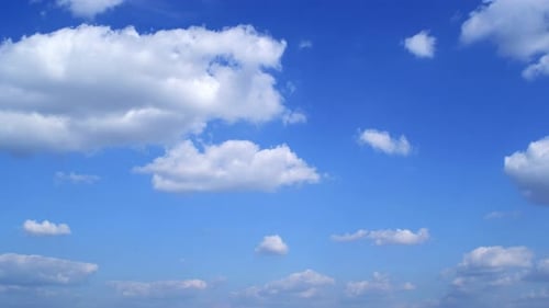 Blue sky with fluffy cloud time lapse on a sunny day 4k footage.