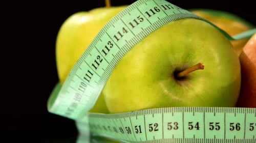 Apple Collection with Measuring Tape, Rotation, Reflection, on Black, Close Up