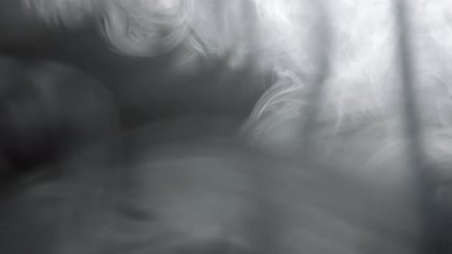 Swirling White Smoke on Grey Background