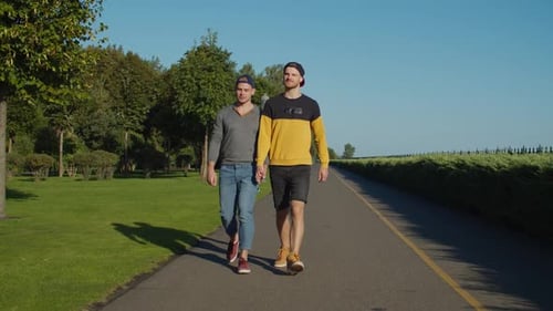 Loving Homosexual Couple Taking a Walk in Park