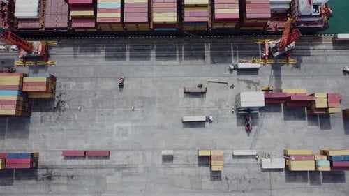 Aerial top view of cargo ship standing in the port