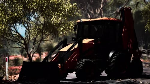 Tractor excavador en Bush Forest