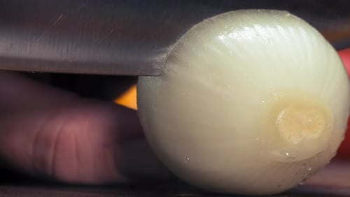 Slicing Fresh White Onion With a Knife