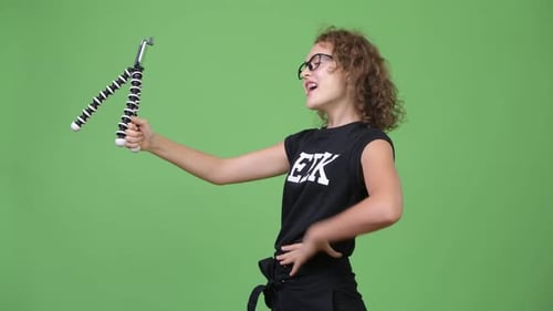 Woman Talking Into Phone On Tripod In Front Of Screen
