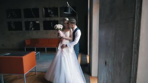 Newlyweds Dancing and Embracing with Affection