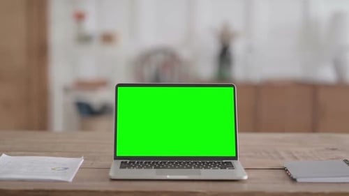 Rear View of Open Laptop with Green Chroma Screen