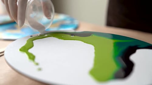 Paint Pouring on Canvas in Art Studio