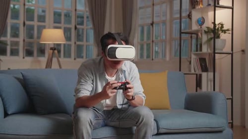 Young Adult Immersed in Virtual Reality Gaming at Home