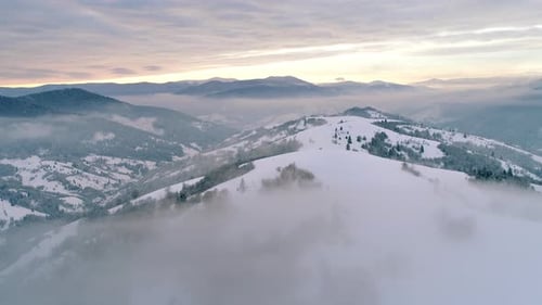 Aerial View in Foggy Sunset Winter Mountain