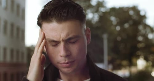 Portrait of Sad Male Face, Close-up of Man Guy Suffering From Headache Migraine Feels Painful