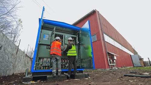 Electricians testing electrical power