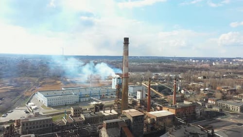 Aerial Shot of Heavy Smoke Pouring From Chemical Factory Into the Atmosphere