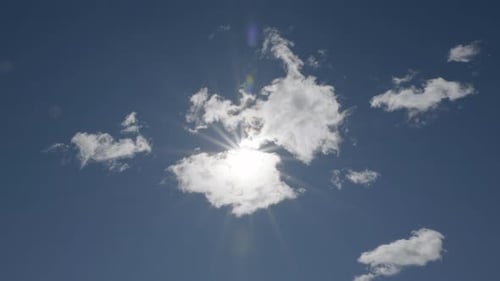White Clouds and Bright Sun in Blue Sky