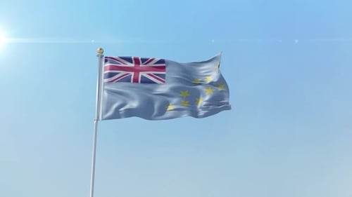 Waving Tuvalu Flag Against Blue Sky with Sun Flare
