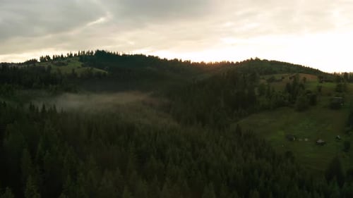 Scenic Mountain Landscape with Fog at Sunrise