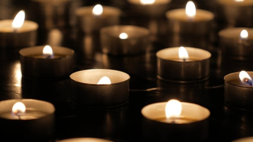 Candles Flicker Gently in the Dark