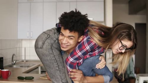 Young Couple Sharing Playful Moment at Home