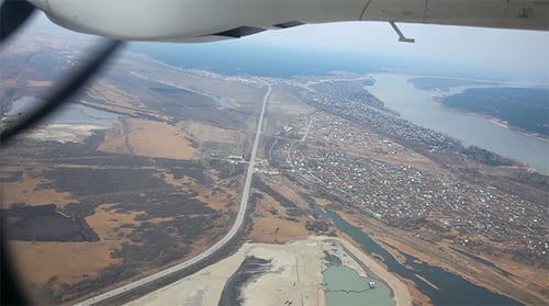 Aerial View of Town and River from Plane Window