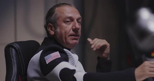Man in Jumpsuit Discusses the Future of Space