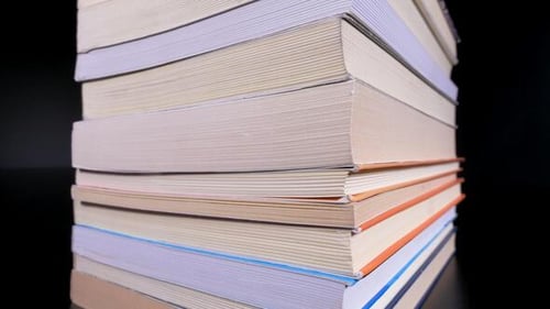 Books Stacked Slowly Building a Pile