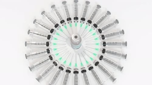 Syringes and Vaccine Vial Arranged in Circle Medical Animation