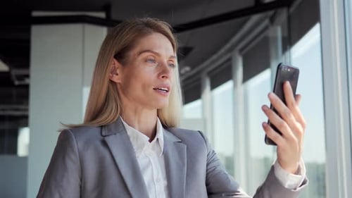 Businesswoman on Video Call in Modern Office