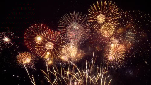 Colorful Golden Fireworks Exploding in the Night Sky
