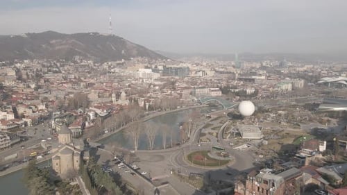 Aerial view of Metekhi church in old Tbilisi located on cliff near river Kura. Georgia 2021 winter