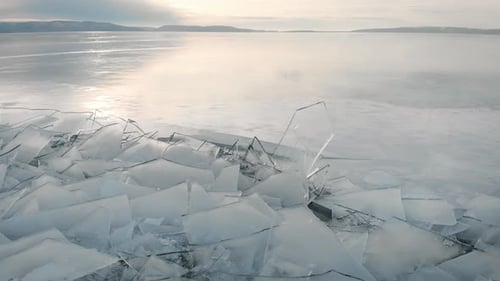 The Northern Landscape of A Frozen Lake or River. Shards of Ice Near the Shore, in The Distance