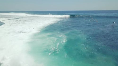 Surfer Riding and Turning with Spray on Powerful Ocean Wave