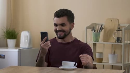 Happy Man Receives Money Over the Phone