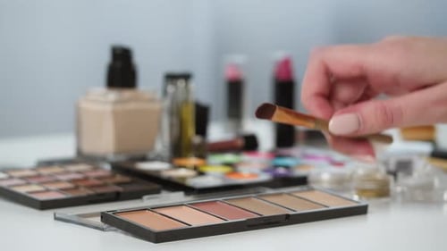 Hand Selecting Fashion Makeup from Beauty Supplies