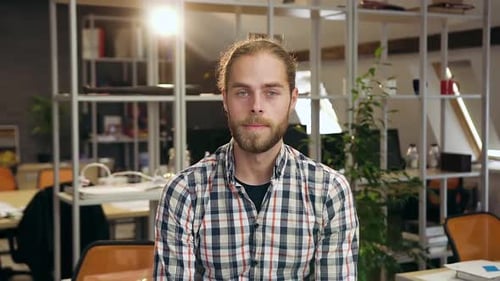 Young Adult Smiling in an Office Environment