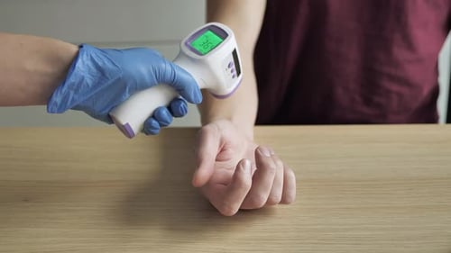 Contactless Thermometer Taking Temperature Reading