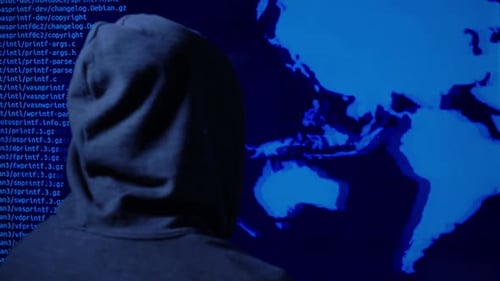 Hacker Typing Code with World Map on Screen
