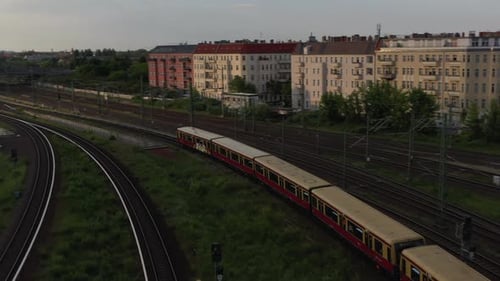 Tracking View of S Bahn Train Arriving Into Station Under Bosebrucke Bridge