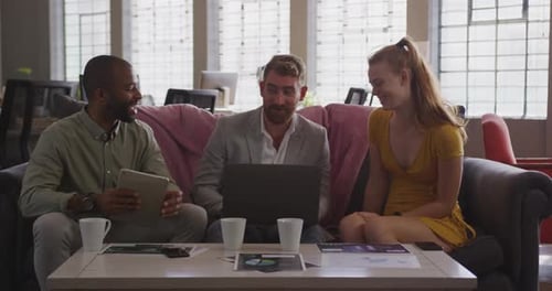 Young creative professionals working in a modern office